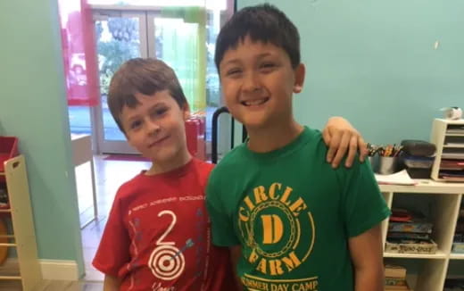 a couple of boys posing for the camera