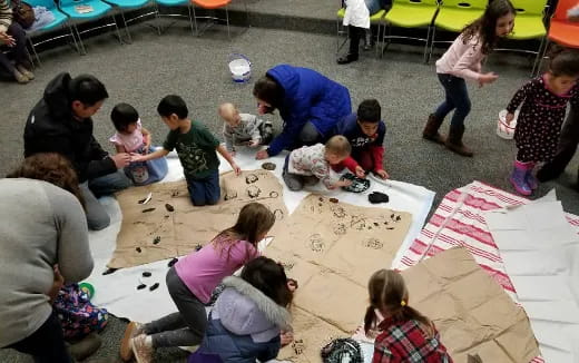 a group of people sitting on the ground