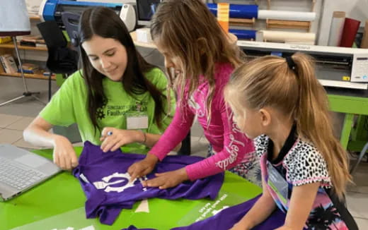 a few young girls working on a project