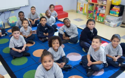 a group of people sitting on the floor