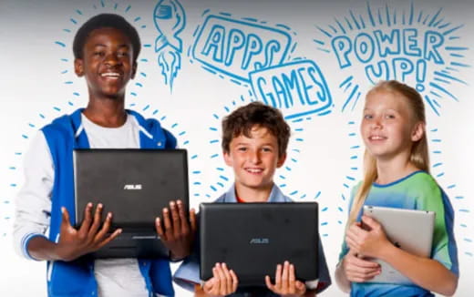 a group of people holding laptops