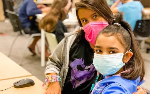 a young girl with a face mask