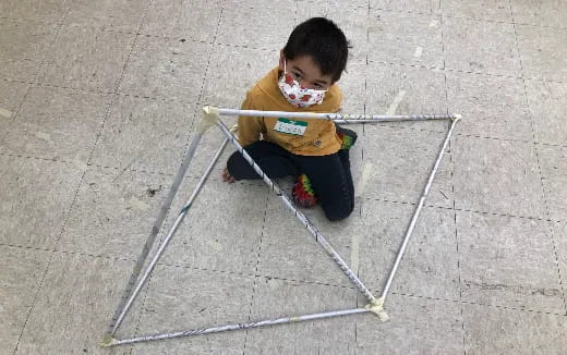 a child sitting on a chair