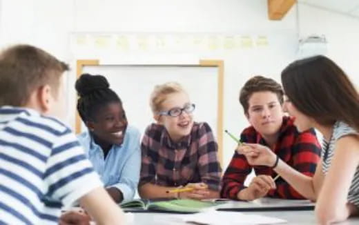 a group of people sitting at a table