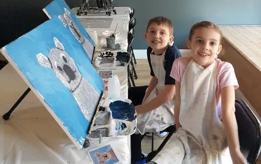 a couple of children posing for the camera