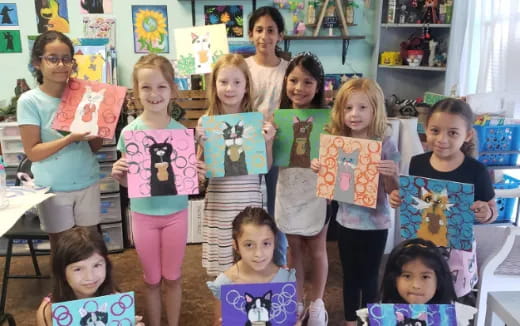 a group of children holding up books