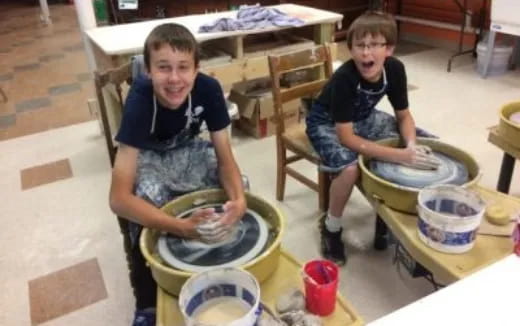 a couple of young boys playing drums