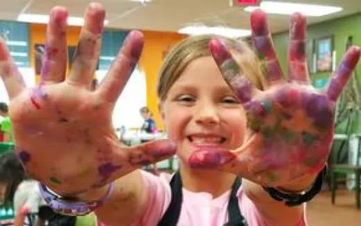 a girl with her hands up