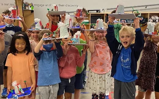 a group of children wearing party hats