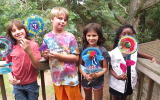 a group of children holding balloons
