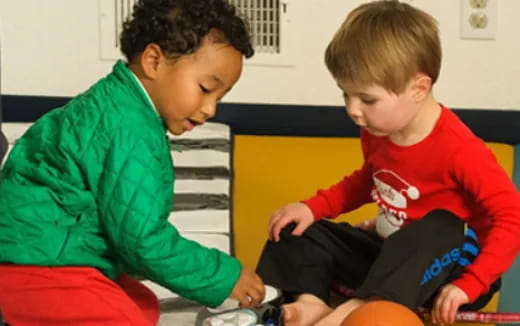 a couple of boys playing with toys