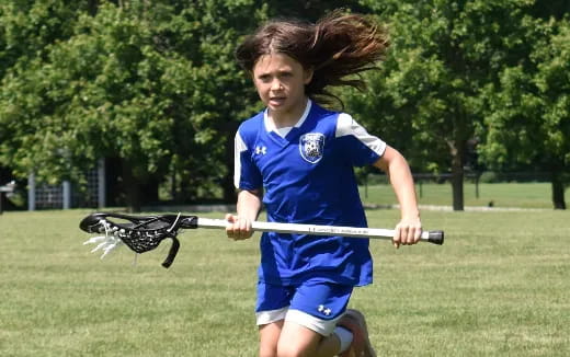 a girl playing with a toy gun