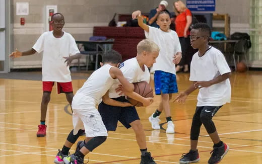 a group of men playing basketball