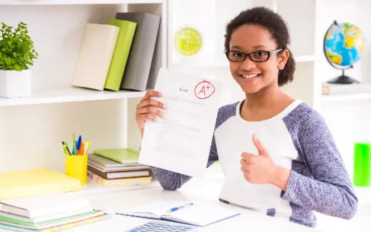a woman holding a piece of paper