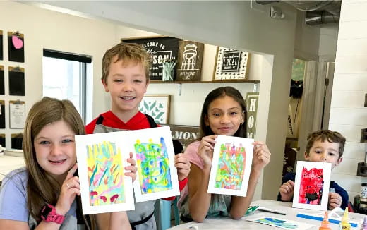 a group of children holding books