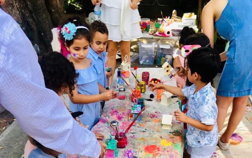 a group of children playing with toys
