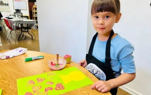 a boy sitting at a table
