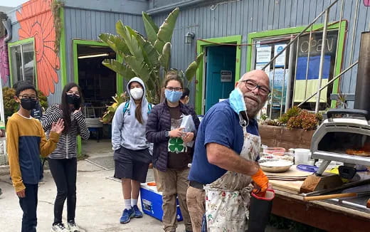 a group of people wearing masks