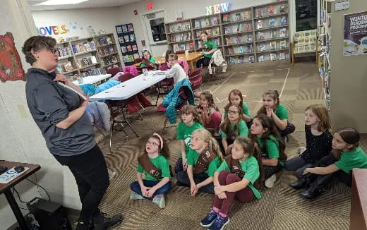 a person teaching a group of children