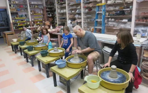a group of people working in a shop