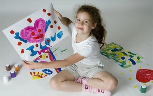 a girl sitting on a bed