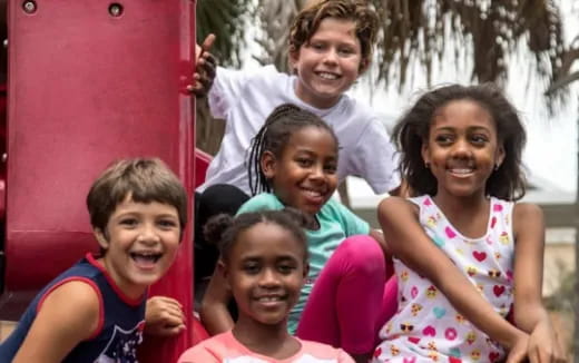a group of children posing for a photo