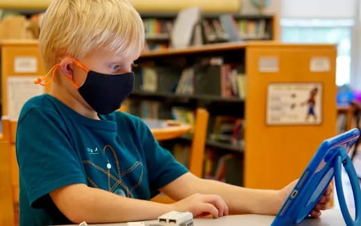 a young boy wearing a headset