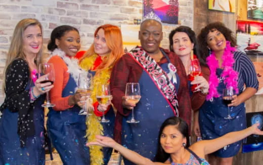 a group of people holding wine glasses