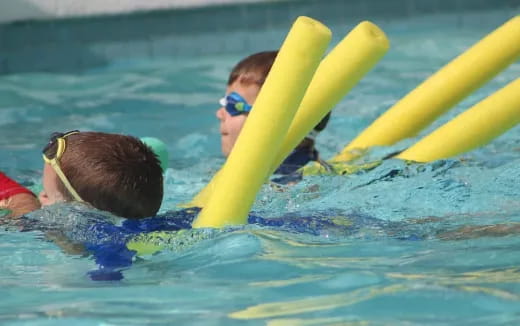 a group of people in a pool