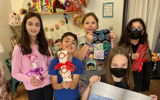 a group of kids wearing masks
