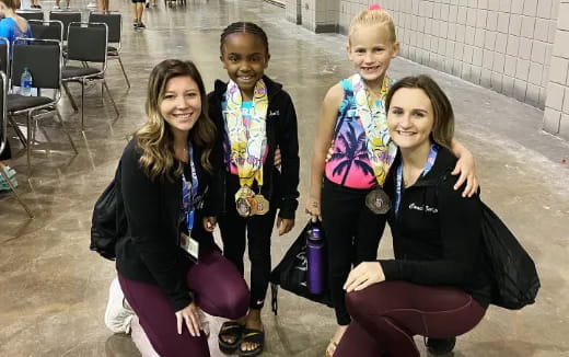 a group of girls posing for a photo