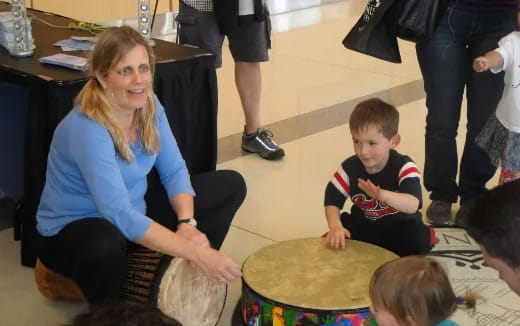 a woman and two children playing a game
