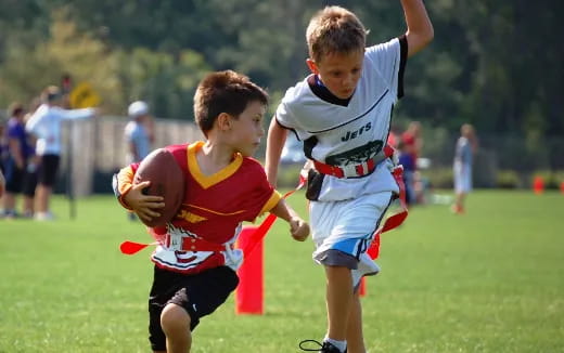 a couple of boys playing football