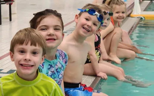 a group of children in a pool