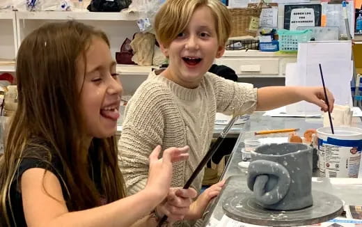 a couple of kids making a science experiment