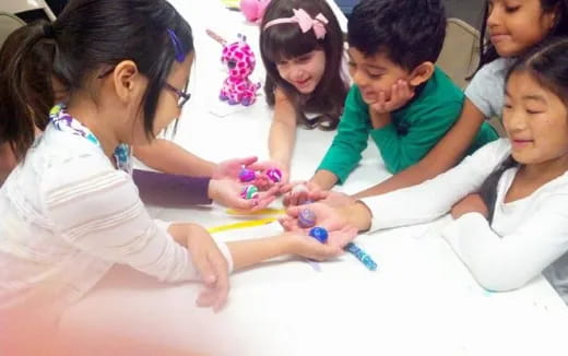 a group of children playing with toys