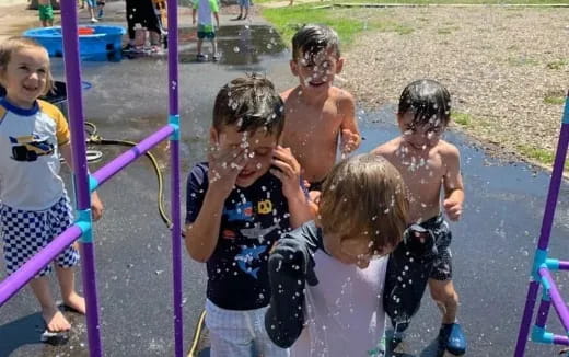 a group of children playing in a playground