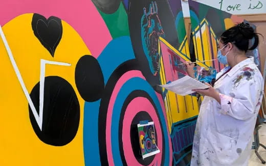 a person painting on a wall
