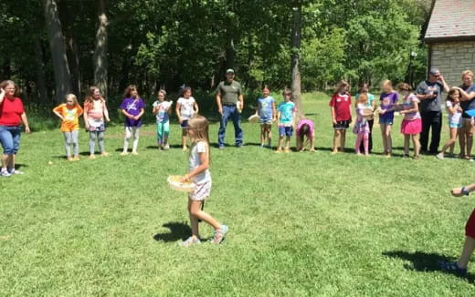 a group of people playing frisbee
