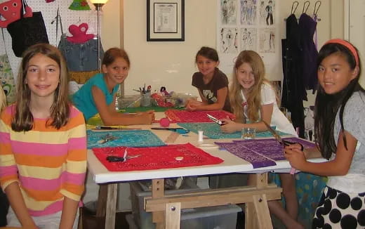 a group of people sitting around a table