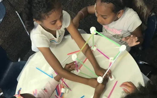 a person and a child painting