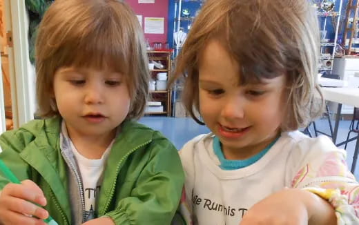a couple of young girls eating