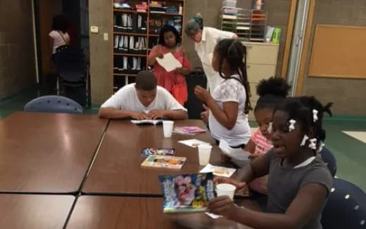 a group of people sitting at a table