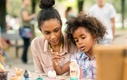 a couple of young girls eating ice cream