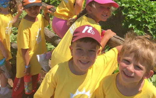 a group of kids wearing yellow shirts