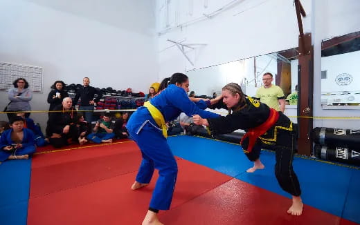 a couple of people in a martial arts class