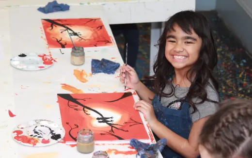 a person painting on a table