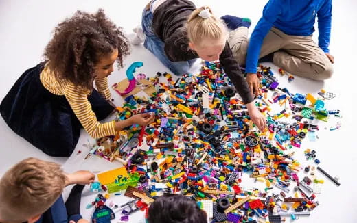 a group of children playing with toys