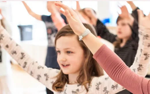 a group of people raising their hands