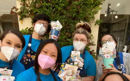 a group of people wearing masks